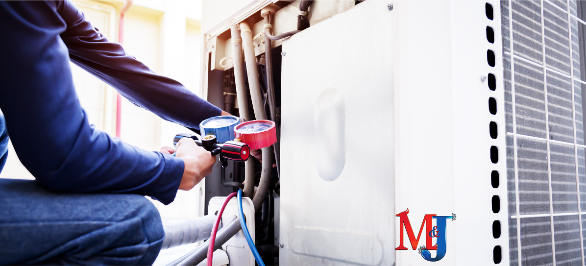 New Orleans Ac repair technician fixing ac unit it gauges